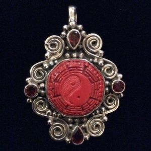 Hand carved cinnabar yin yang with 4 garnet stones